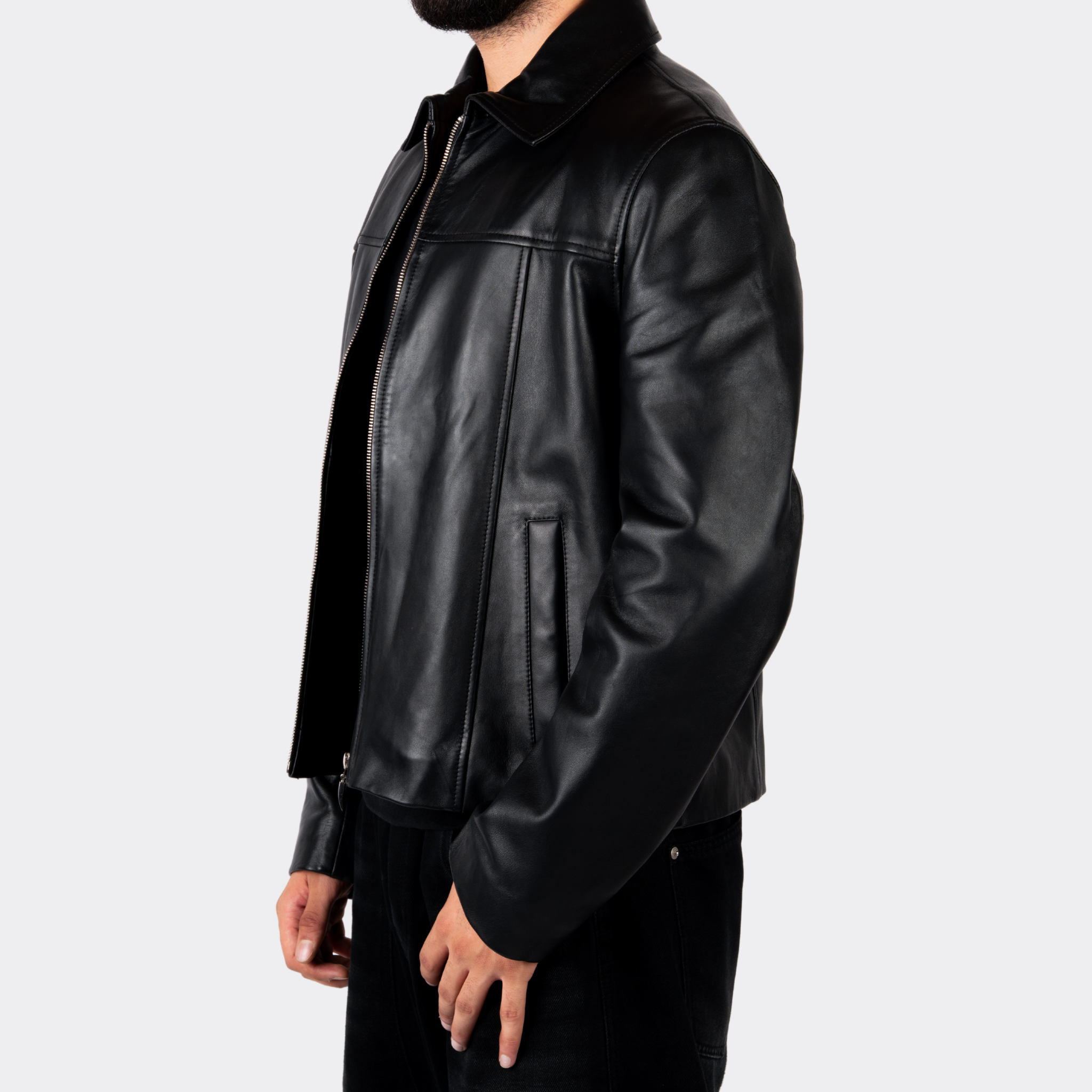 Black leather jacket worn by a person on a light gray background Blaatan The Axiom Classic Edition Obsidian Black Streetwear Leather Jacket for Men