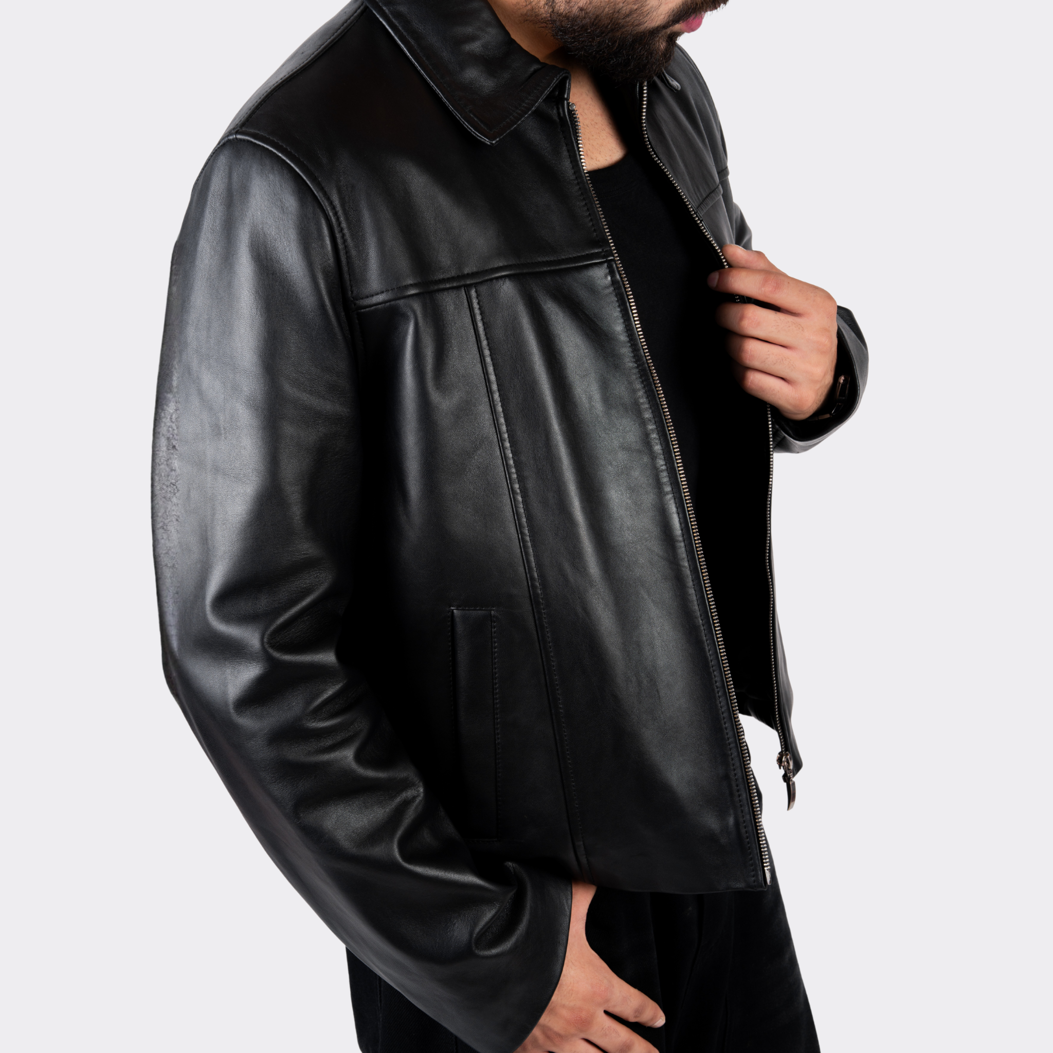 Black leather jacket worn by a person on a light gray background Blaatan The Axiom Classic Edition Obsidian Black Streetwear Leather Jacket for Men