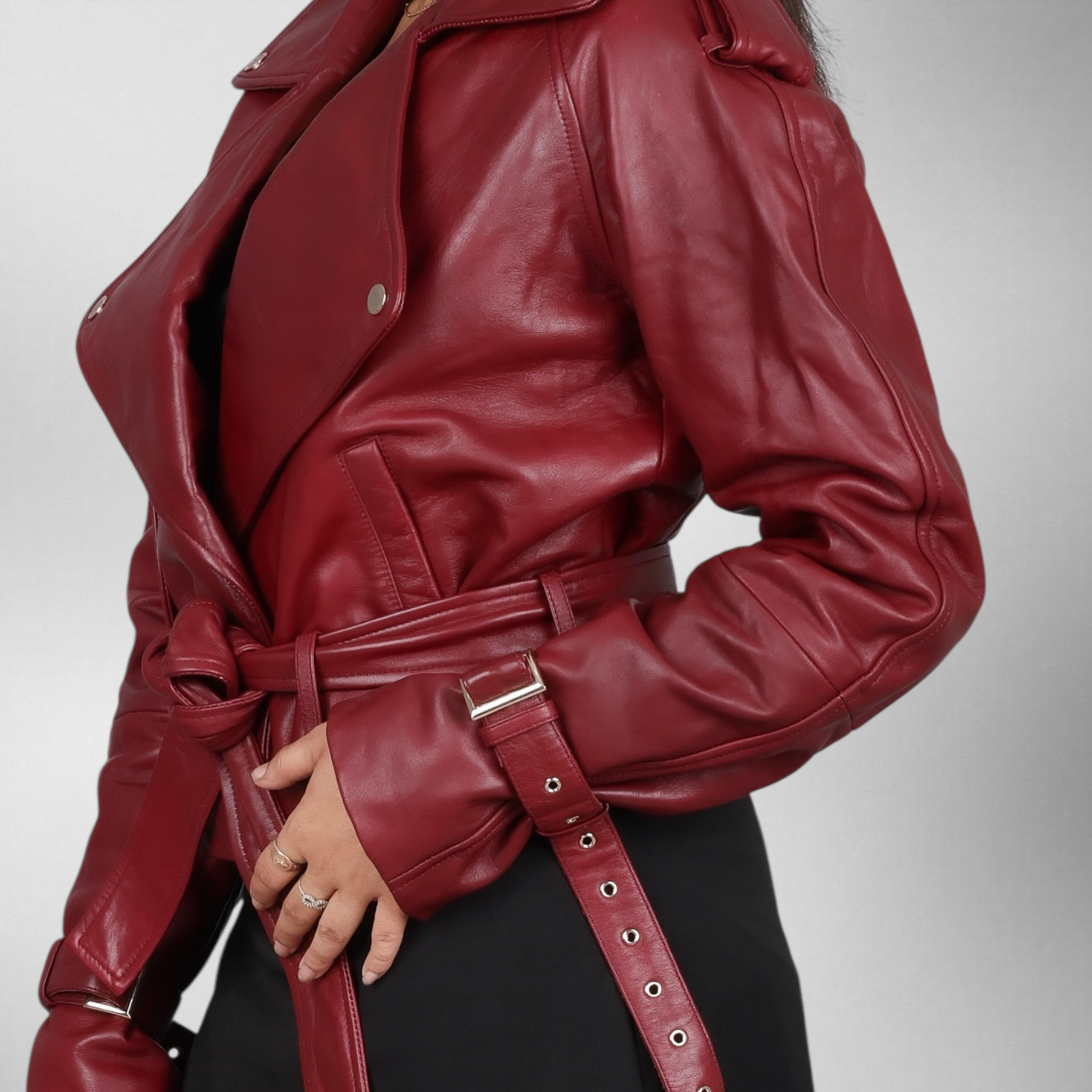 Red leather jacket with a belt on a neutral background Blaatan The Cordova Crimson Edition Crimson Burgundy Party Wear Leather Jacket for Women