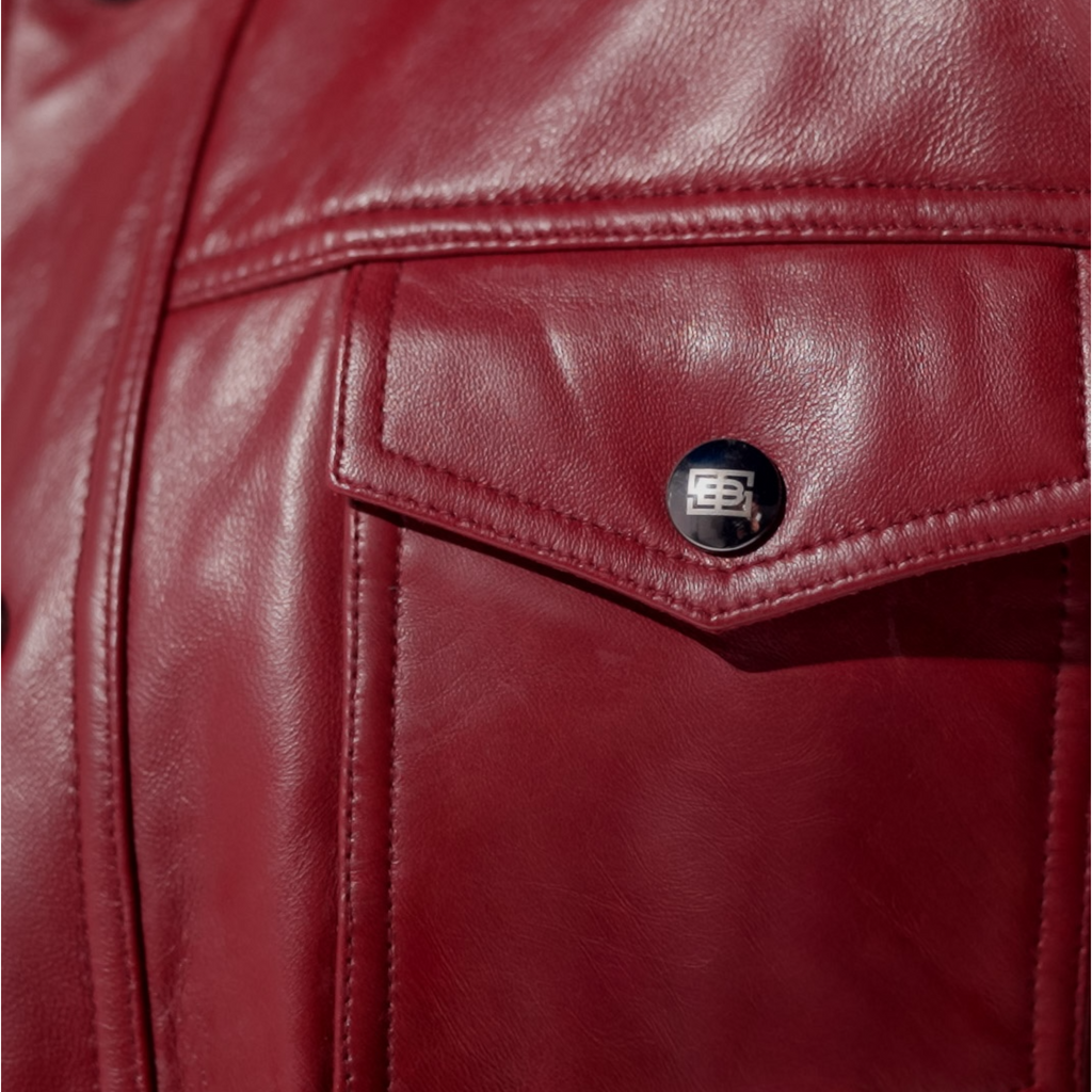 Close-up of a red leather jacket with a brand logo on the pocket. Blaatan The Garnet Crimson Edition Crimson Burgundy Leather Jacket for Men