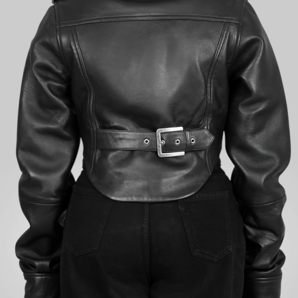 Black leather jacket with a belt and buckle on a gray background Blaatan The Silene Corset Edition Obsidian Black Corset Style Biker Leather Jacket for Women